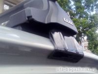 Универсальный багажник на крышу D-Lux 1 на Lada Xray, стальные прямоугольные дуги